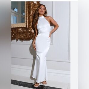 Elegant white gown with high neck and open back